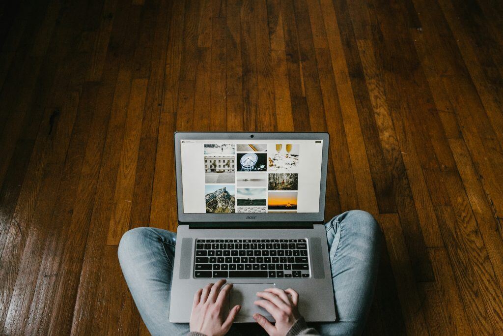 person working on floor, which a remote worker might do