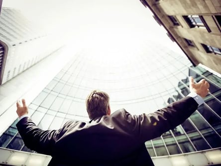 guy in a suit looking up