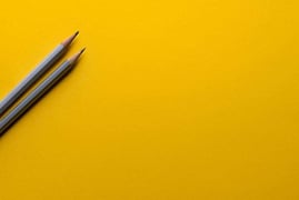 Pencils on paper, emphasizing the customization and branding options available with Toasty