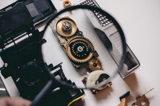 A close up of a mechanical contraption, indicating attention to detail, which is a valuable trait of a good employee