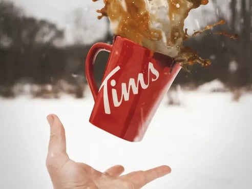 Tims mug thrown in the air