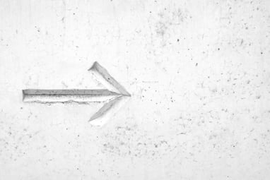 arrow sign on concrete