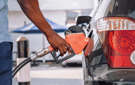 man pumping gas into his car